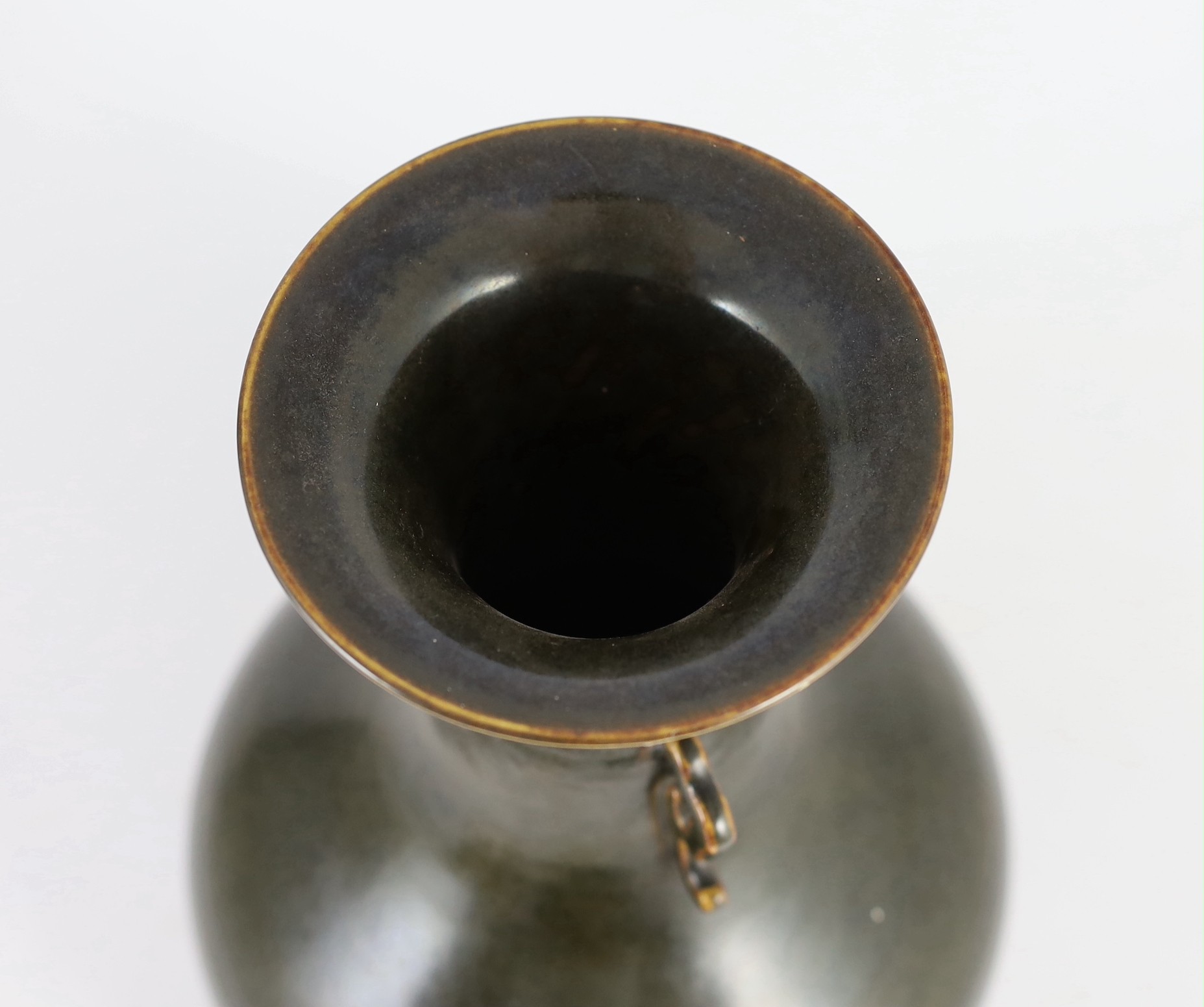 A Chinese Jian style brown glazed vase, hu, 18th/19th century, 31.5cm high, cracked, wood stand